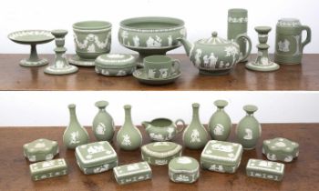 Large collection of sage green Wedgwood Jasperware each piece decorated with cream details in low