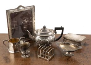 Collection of silver including: a silver teapot with repousse decoration and angular ebony handle,