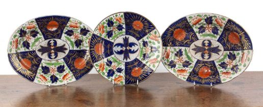 Three Imari patterned plates comprising of a pair of oval platters, decorated with flowers,