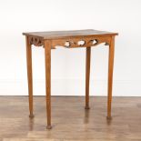 In the manner of Liberty & Co oak, table with cut out supports, standing on stepped feet, 69cm