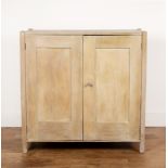 Heals cupboard limed oak, design number '348', with two panelled doors enclosing shelves, raised