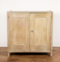 Heals cupboard limed oak, design number '348', with two panelled doors enclosing shelves, raised