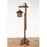 In the manner of Arthur Romney-Green (1872-1945) Arts and Crafts, oak, hanging lantern, the