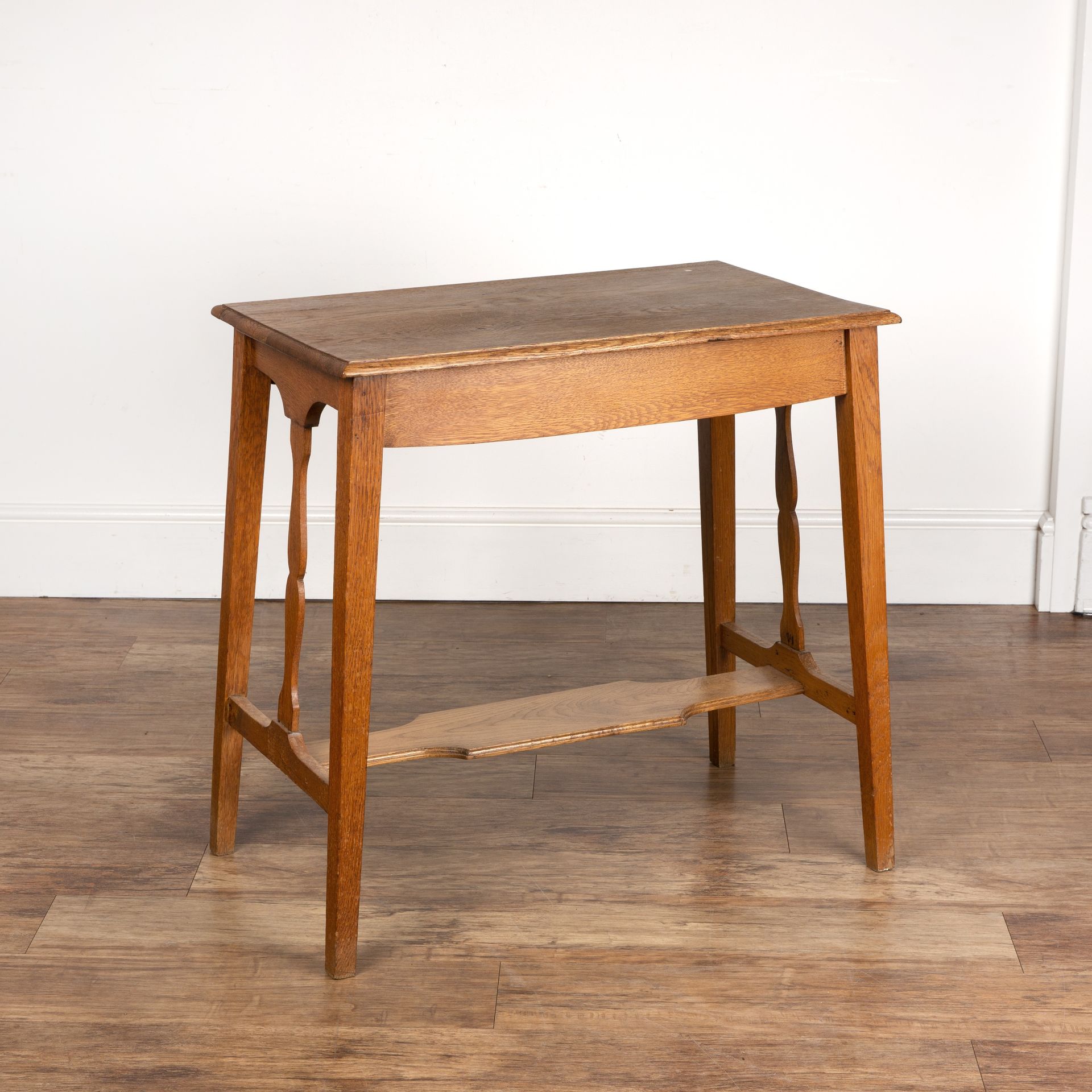 In the manner of Liberty & Co oak, side table with tapering shaped supports, unmarked, 75.5cm wide x