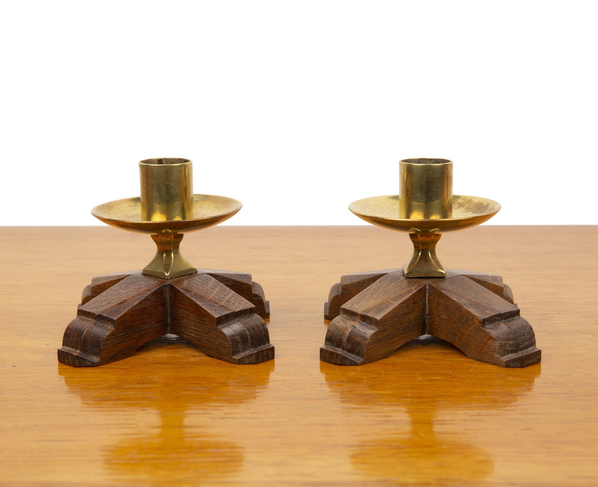 Gordon Russell Ltd of Broadway pair of oak and brass candlesticks, stamped 'Gordon Russell Ltd' to