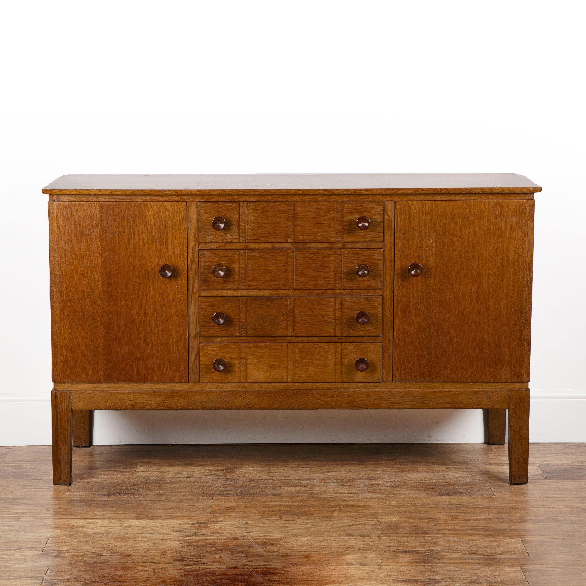 Gordon Russell (1892-1980) oak, Utility sideboard, with four central drawers flanked on each side by