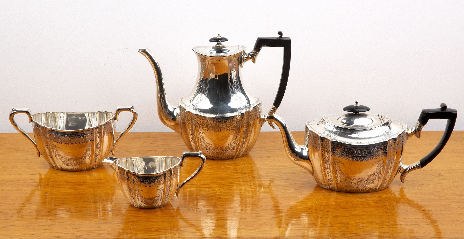 Edward VII silver four piece tea service comprising a teapot, hot water jug, cream jug and twin