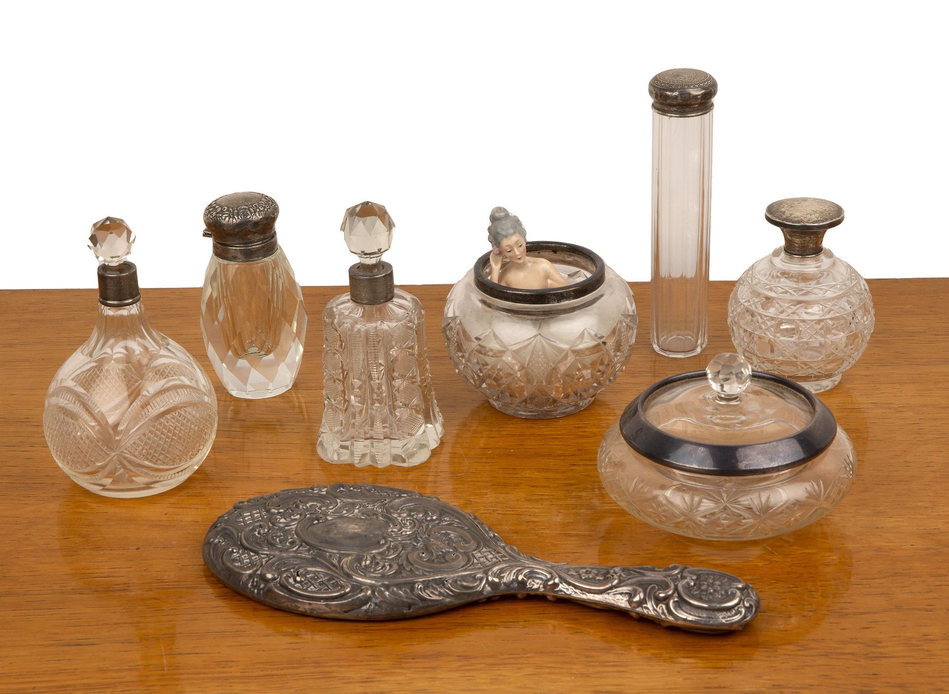 Collection of silver mounted dressing table requisites to include: handheld mirror, hobnail cut