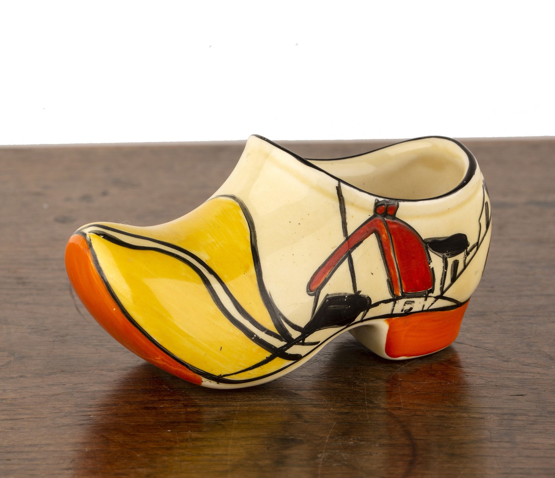 Clarice Cliff (1899-1972) 'House and bridge', model of a clog, marked to the base, 6cm high x 10.5cm
