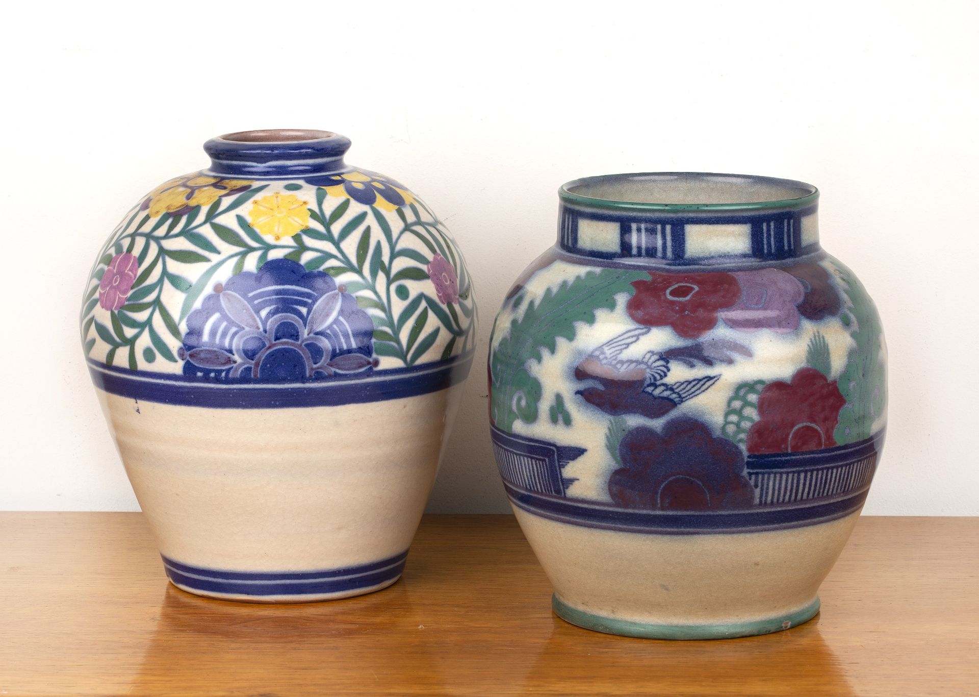 Truda Adams for Poole Pottery two large vases, the first decorated with a stylised bird and flowers,