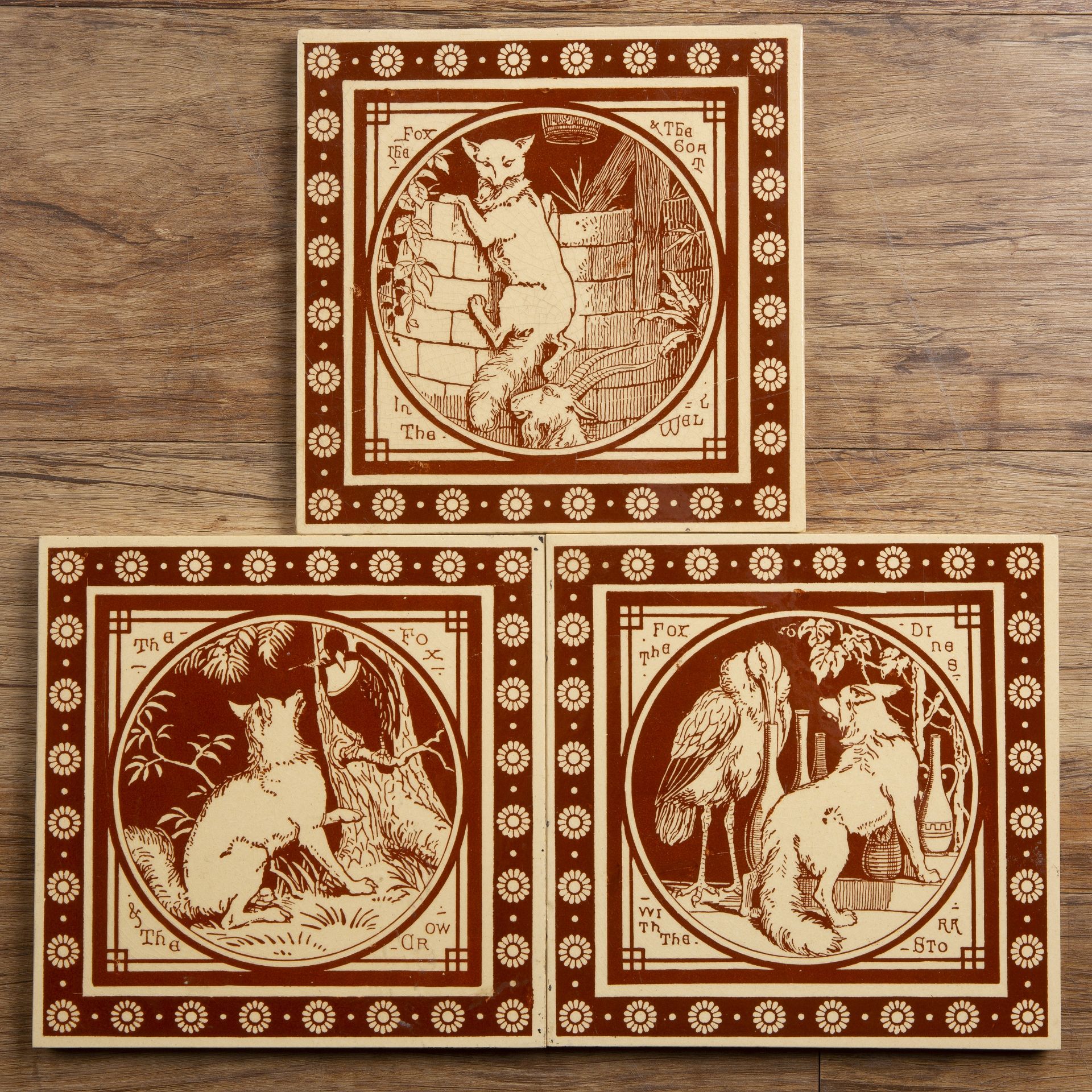 Three Mintons tiles from the 'Aesop's fables' series, the fox dines with the crow, the fox and the