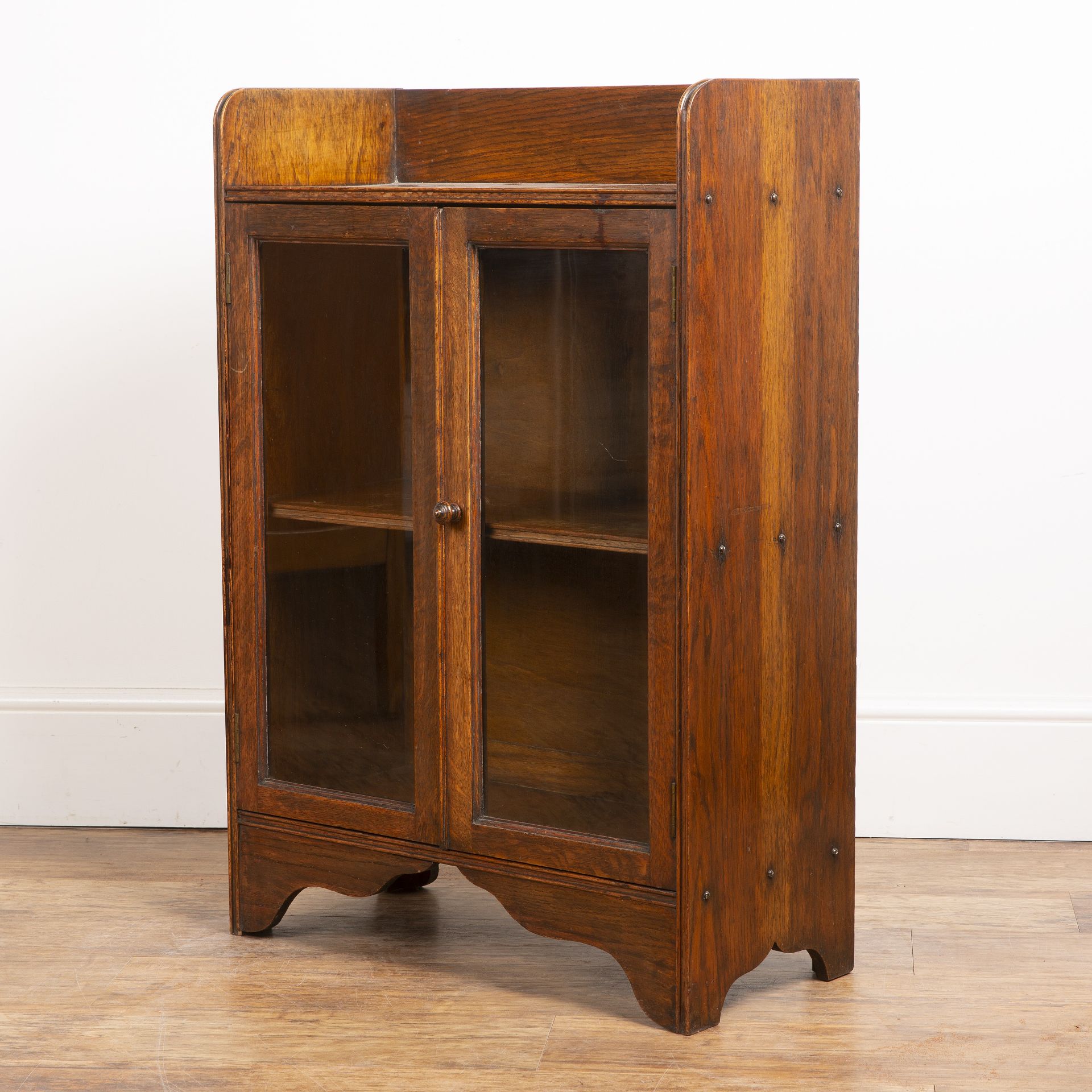 Attributed to Heals oak cupboard, with galleried top, two glazed panel doors with a turned wooden - Image 4 of 5