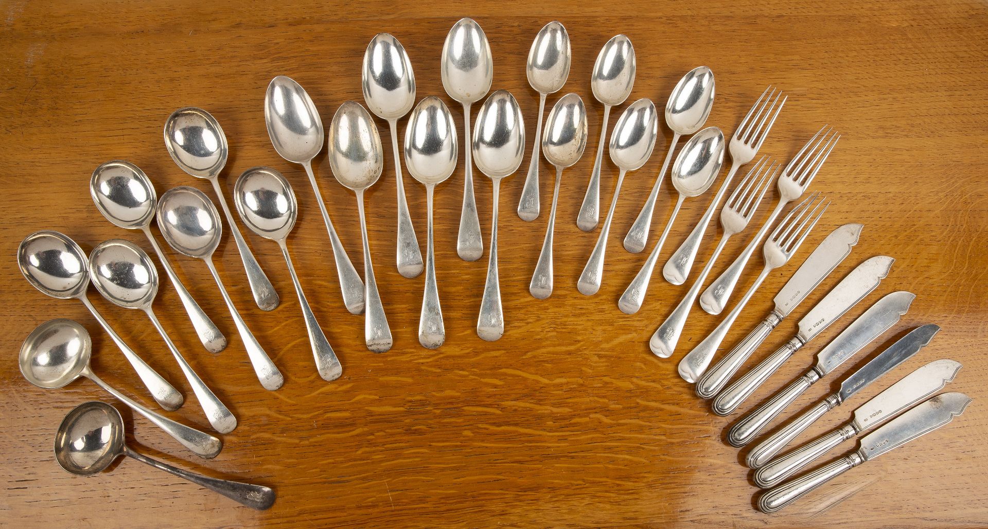 Collection of silver flatware to include: six spoons, six tablespoons, two serving spoons, four