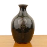Winchcombe Pottery large iron glazed bottle vase, decorated with traditional motifs, impressed