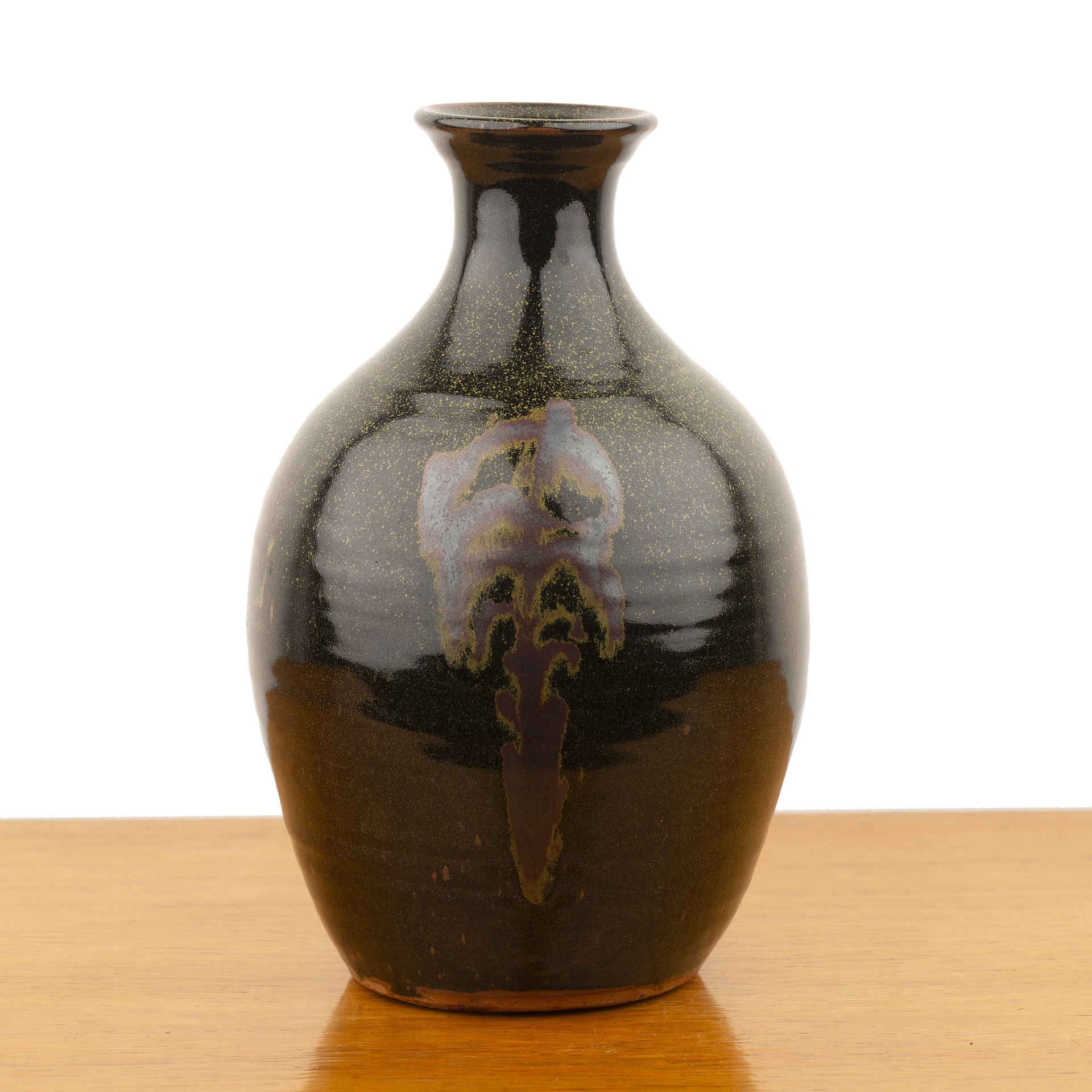 Winchcombe Pottery large iron glazed bottle vase, decorated with traditional motifs, impressed