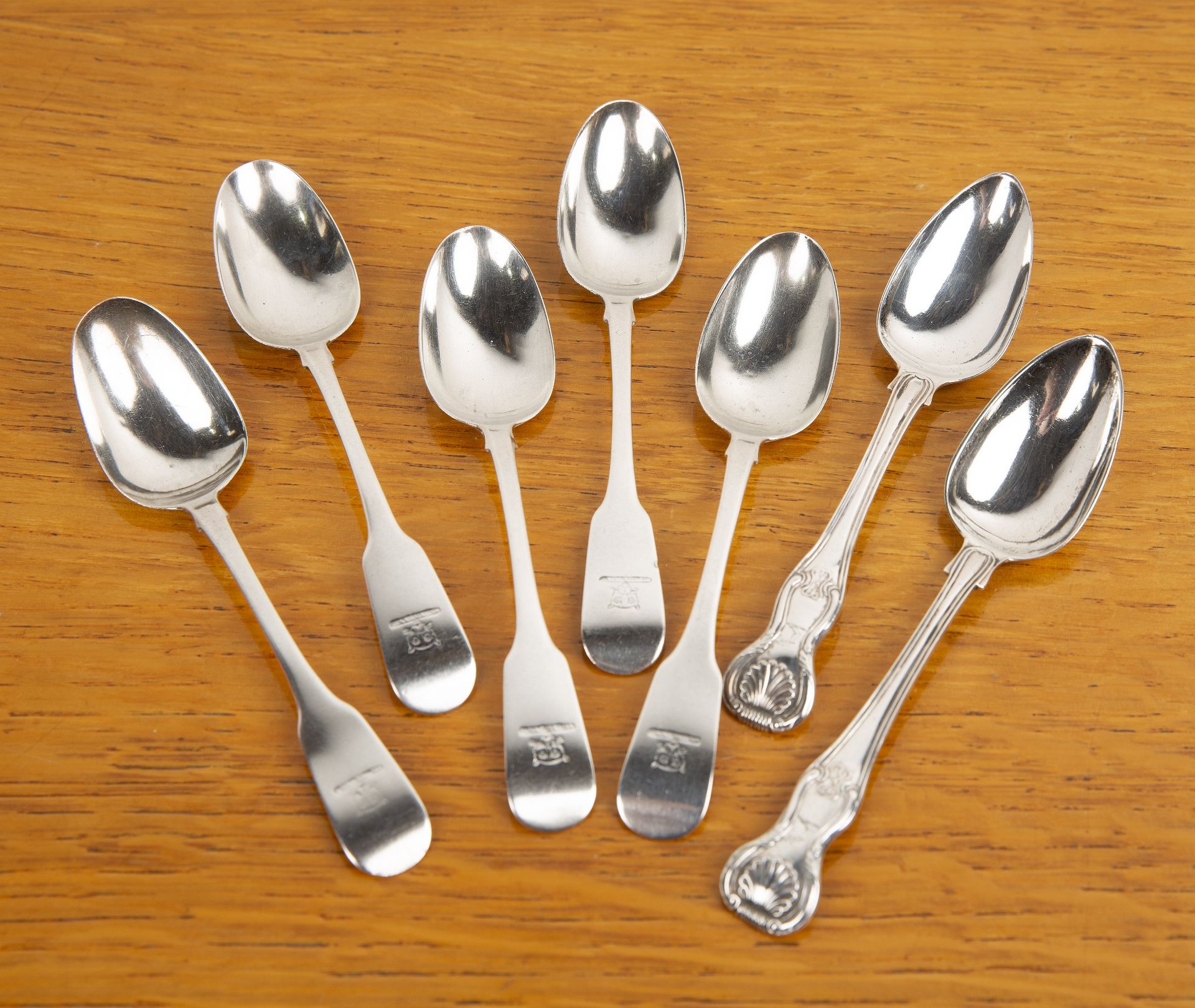 Collection of Irish silver spoons comprising: a set of five Georgian silver fiddle pattern spoons,