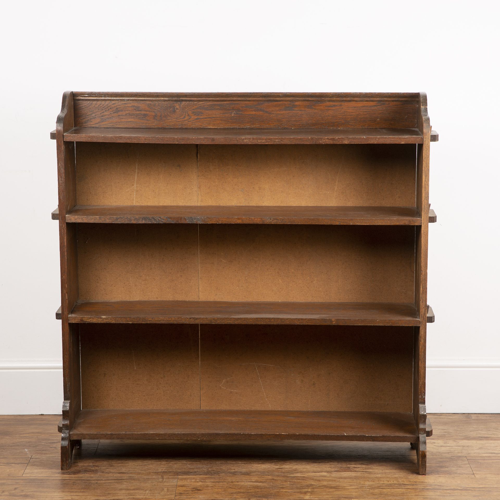 20th Century oak, open bookcase, of pegged construction detailing to either side, with four fitted
