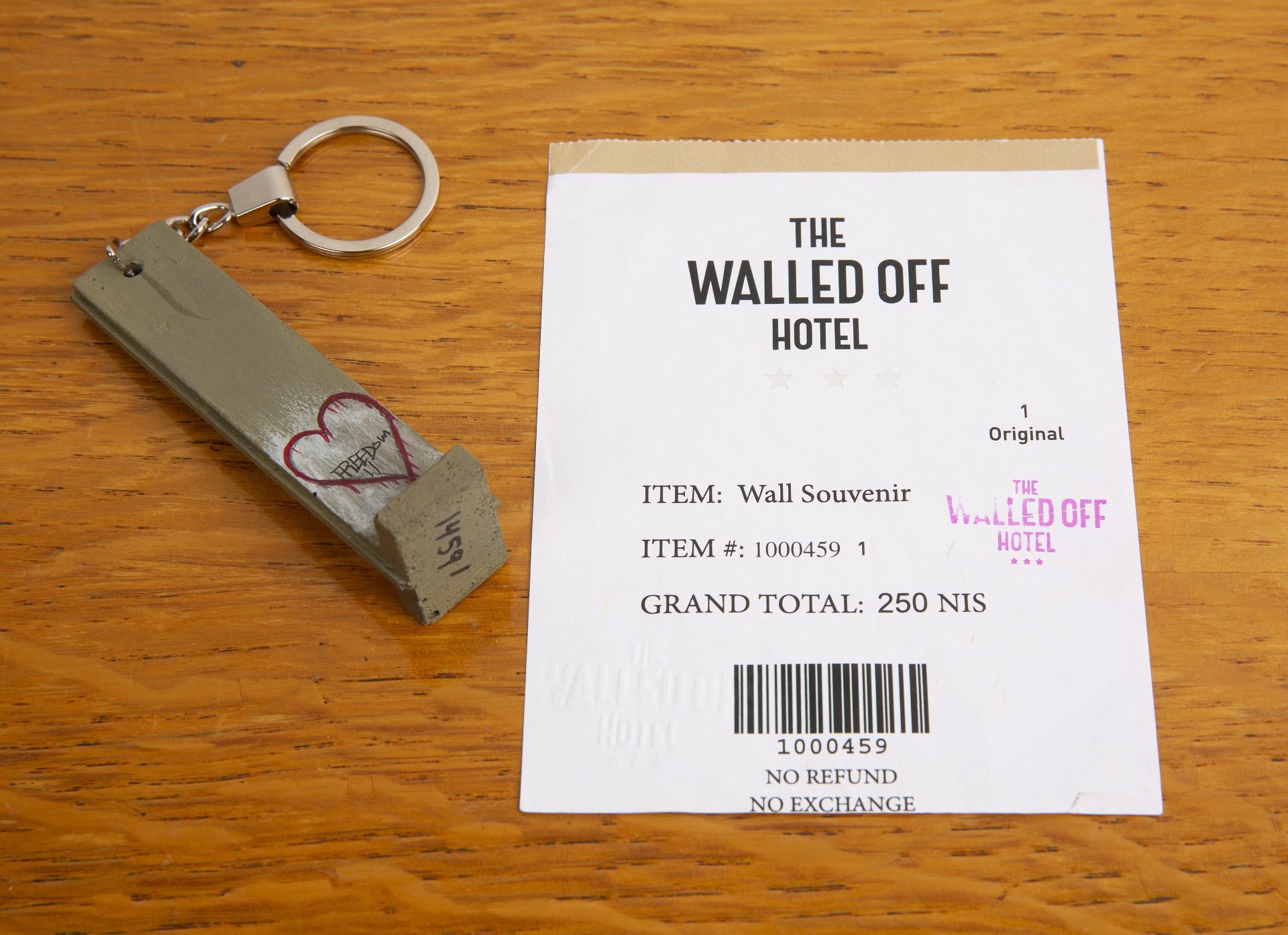 Banksy (b.1974) (The walled off hotel), freedom sculpture or key fob, painted wood, numbered 14591 - Bild 6 aus 6
