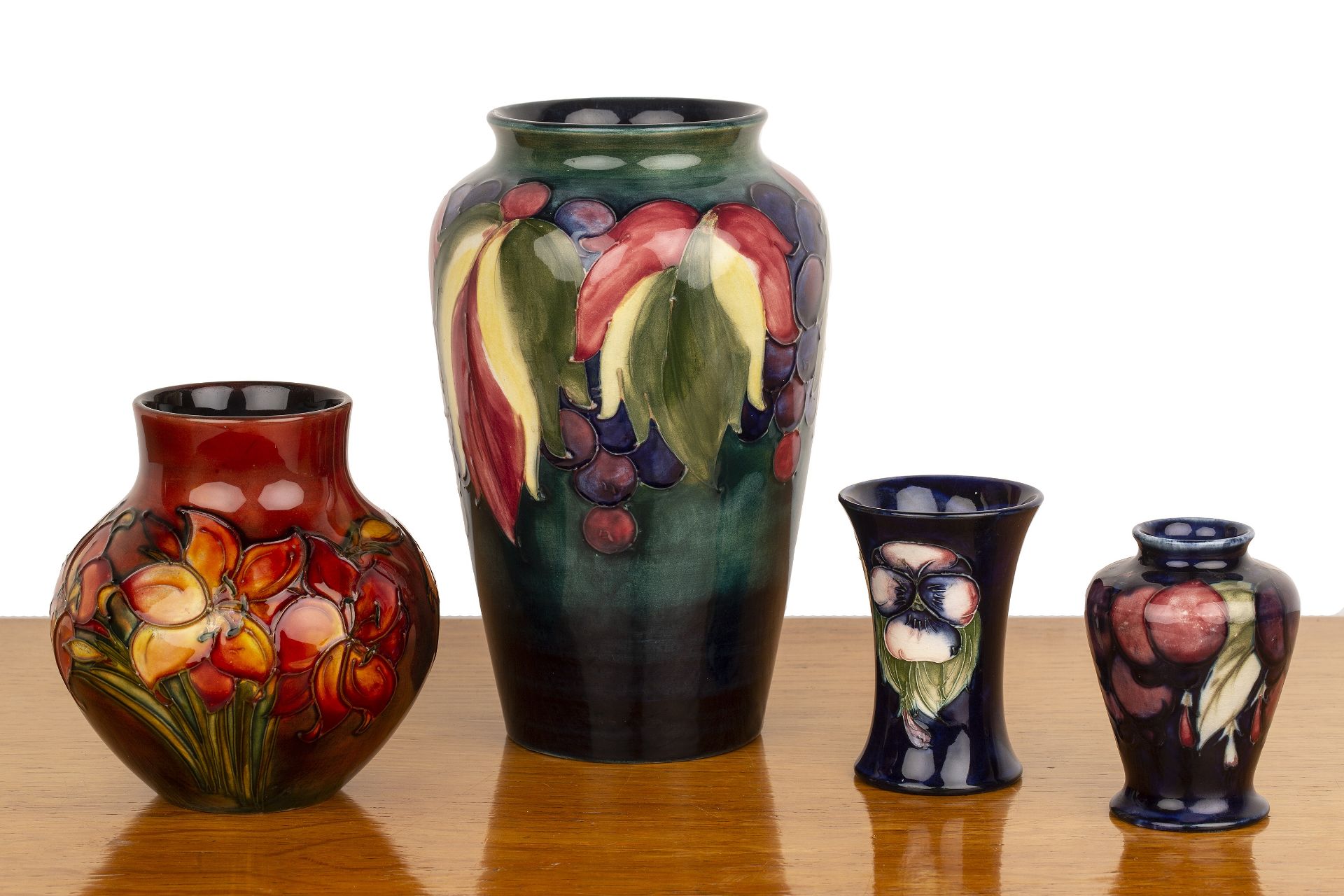 Collection of Moorcroft vases comprising a large 'leaf and berry' tapering vase on blue ground, - Image 2 of 3
