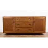 Luciano Ercolani (1888-1976) for Ercol elm sideboard, fitted with two cupboards and three central
