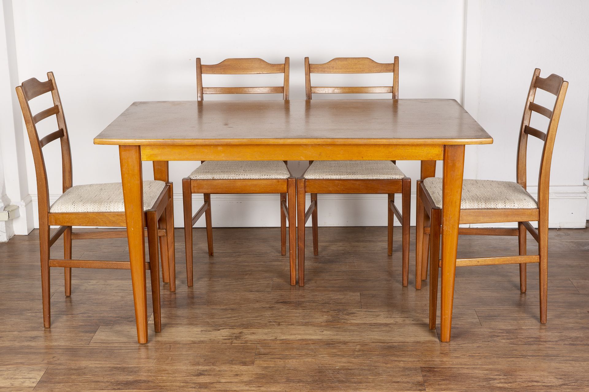 Gordon Russell of Broadway teak dining table and set of four chairs, the table with an applied label