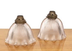 Two Holophane glass ceiling lights with ribbed decoration and pierced brass galleries, with