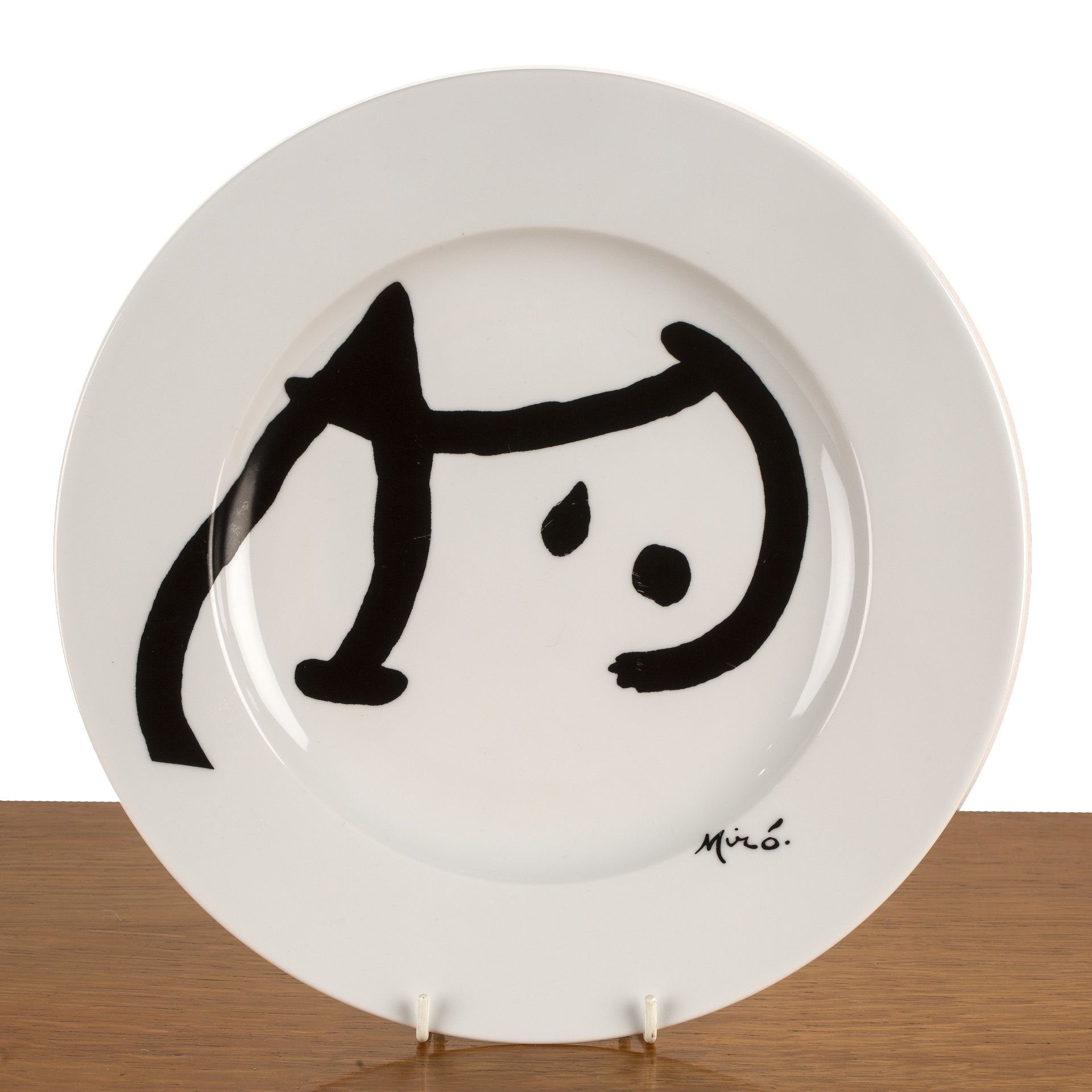 After Joan Miro (1893-1983) ceramic plate, dated 2002, marked to the reverse, 30.5cm overall Overall