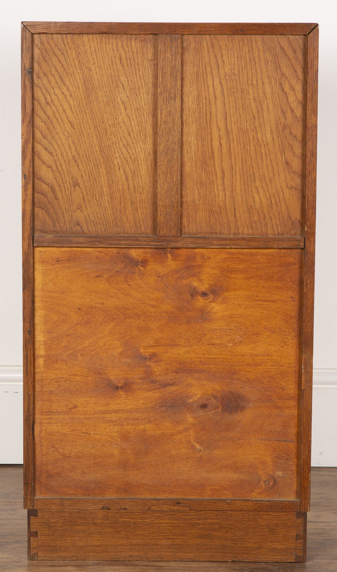 Attributed to Heals oak, small cupboard or bedside table, with open shelf above a fielded panel - Image 5 of 5