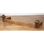 Yorkshire School oak, fire surround or guard, with carved figures at either end, 139.5cm external