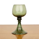 Attributed to James Powell and Sons green glass goblet or drinking glass, a bulbous bowl on