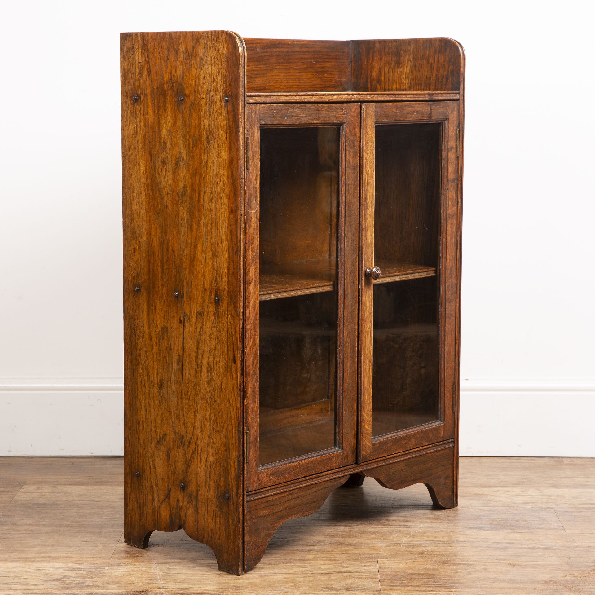Attributed to Heals oak cupboard, with galleried top, two glazed panel doors with a turned wooden - Image 3 of 5