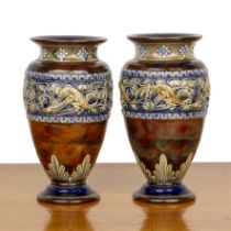 Royal Doulton Lambeth Pair of oviform vases, decorated with bands of lizards, beetles and leaves,