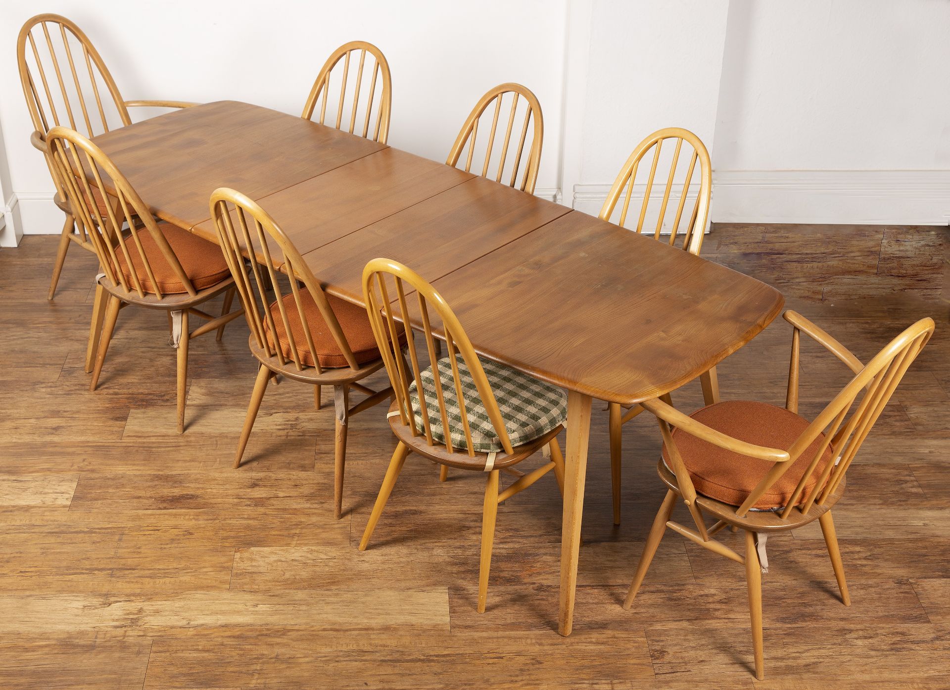 Luciano Ercolani (1888-1976) for Ercol elm and beech extending dining table and eight hoop back