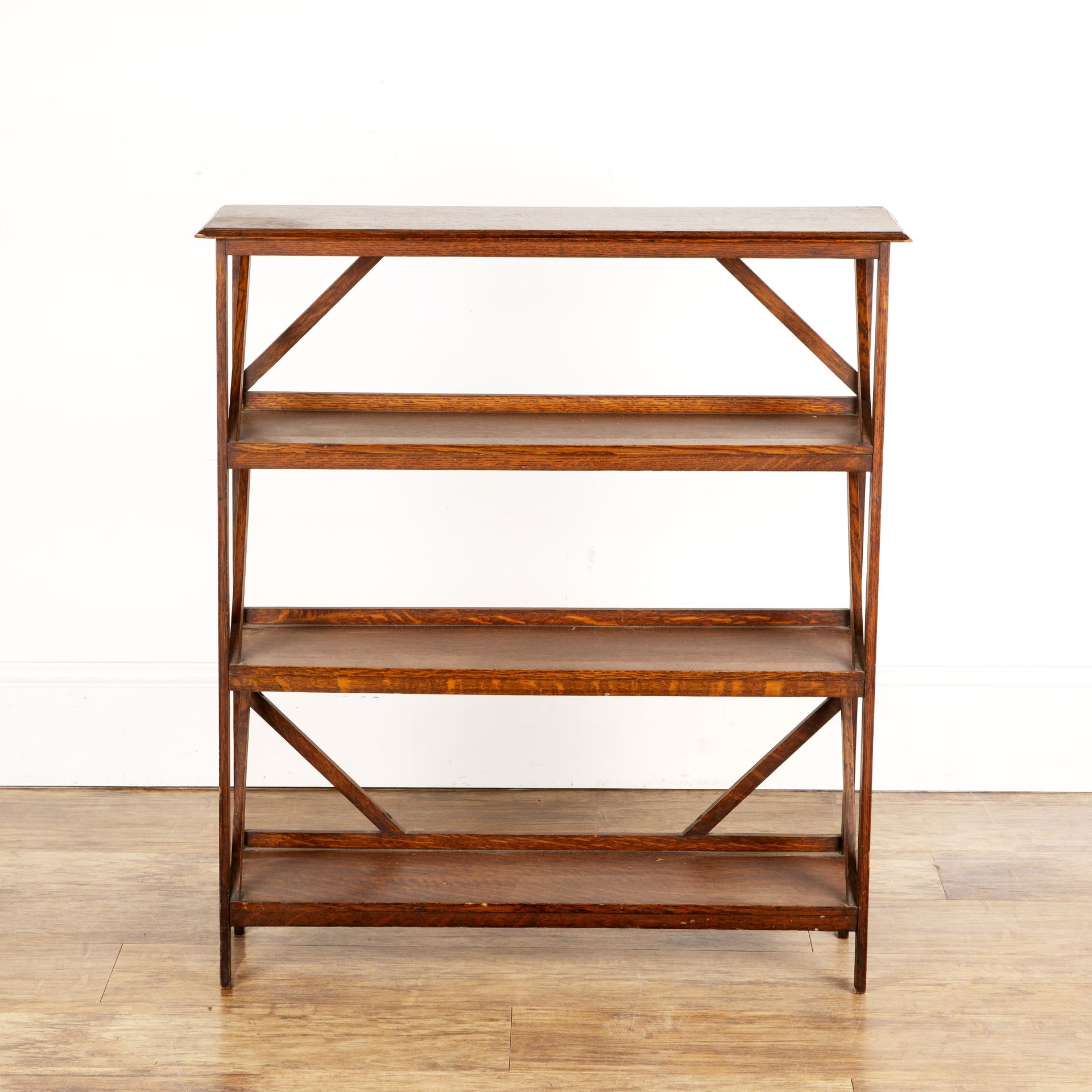 In the manner of Heals oak, open bookcase, with diagonal supports, 76cm wide x 86cm high x 20.5cm
