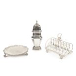 An early Victorian silver seven bar toast rack, the shaped and curved divisions with oval loop