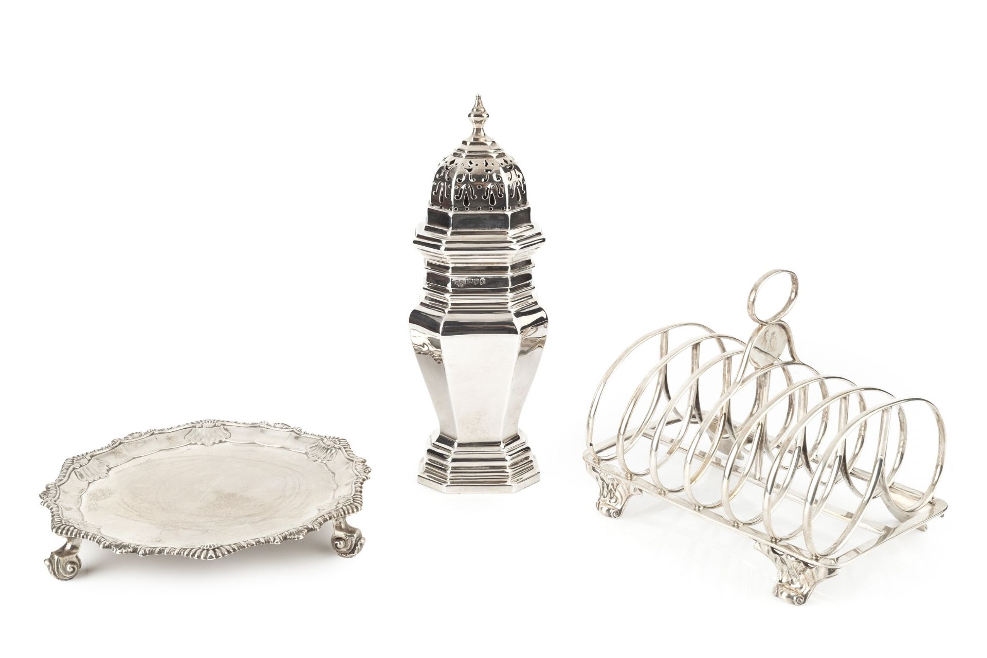 An early Victorian silver seven bar toast rack, the shaped and curved divisions with oval loop