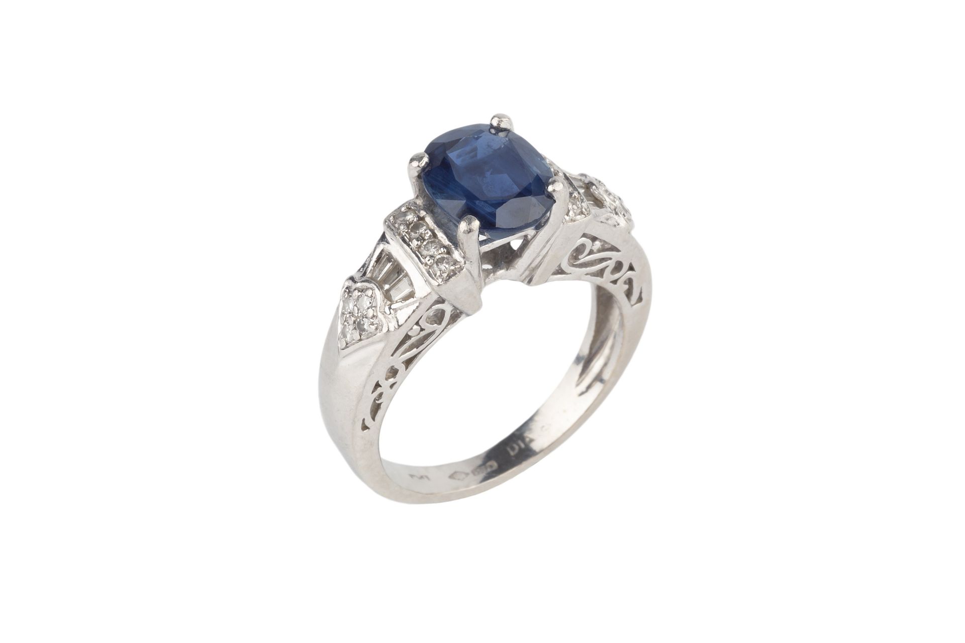 A sapphire and diamond dress ring, the oval mixed-cut sapphire claw set between graduating shoulders