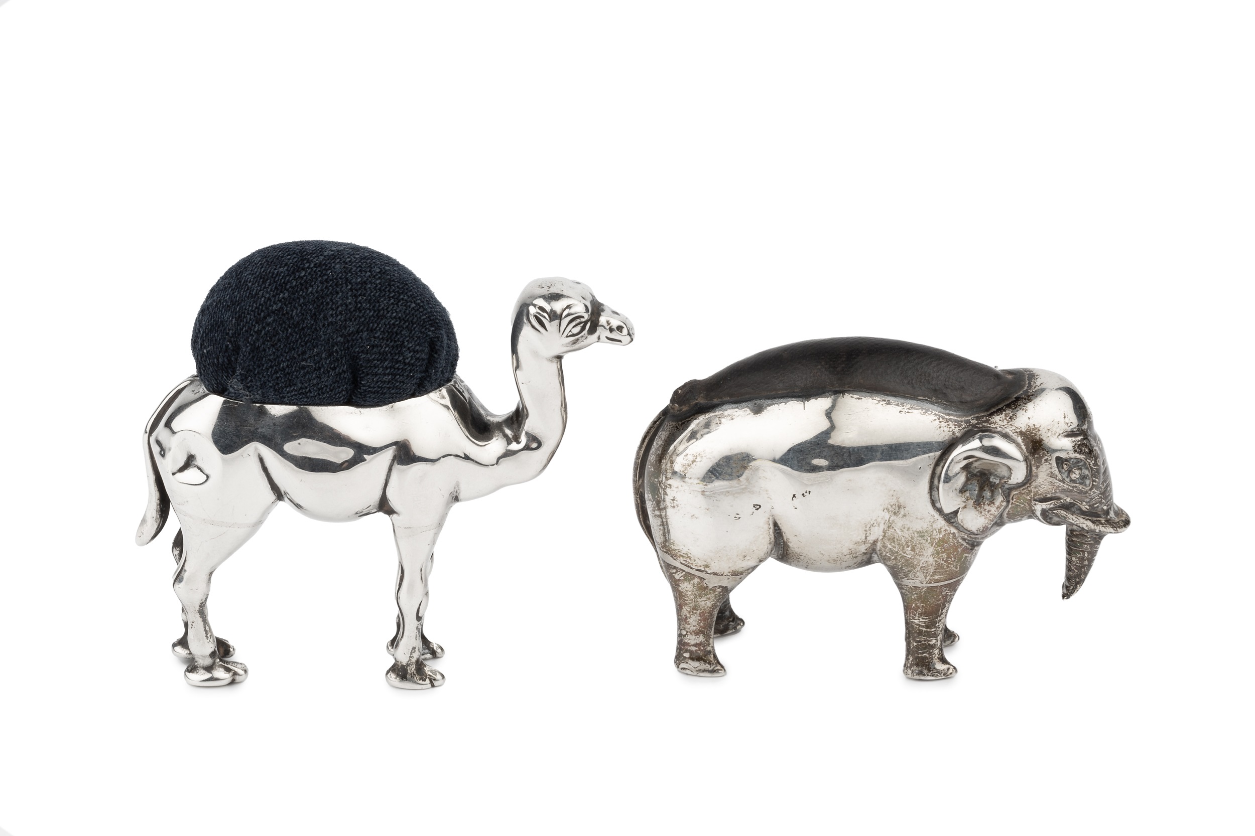 An Edwardian silver novelty pincushion, modelled as a camel, maker's mark worn, Birmingham 1907, 5.