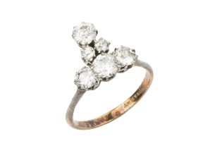 A diamond cluster ring, set with four principal and two smaller old cut stones in a T shaped design,
