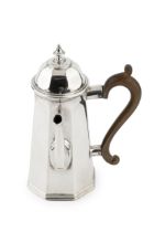 A late Victorian silver side handled bachelor's coffee pot, of tapering octagonally faceted form,