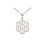 An 18ct white gold, diamond and seed pearl openwork pendant, of hexagonal design, composed of