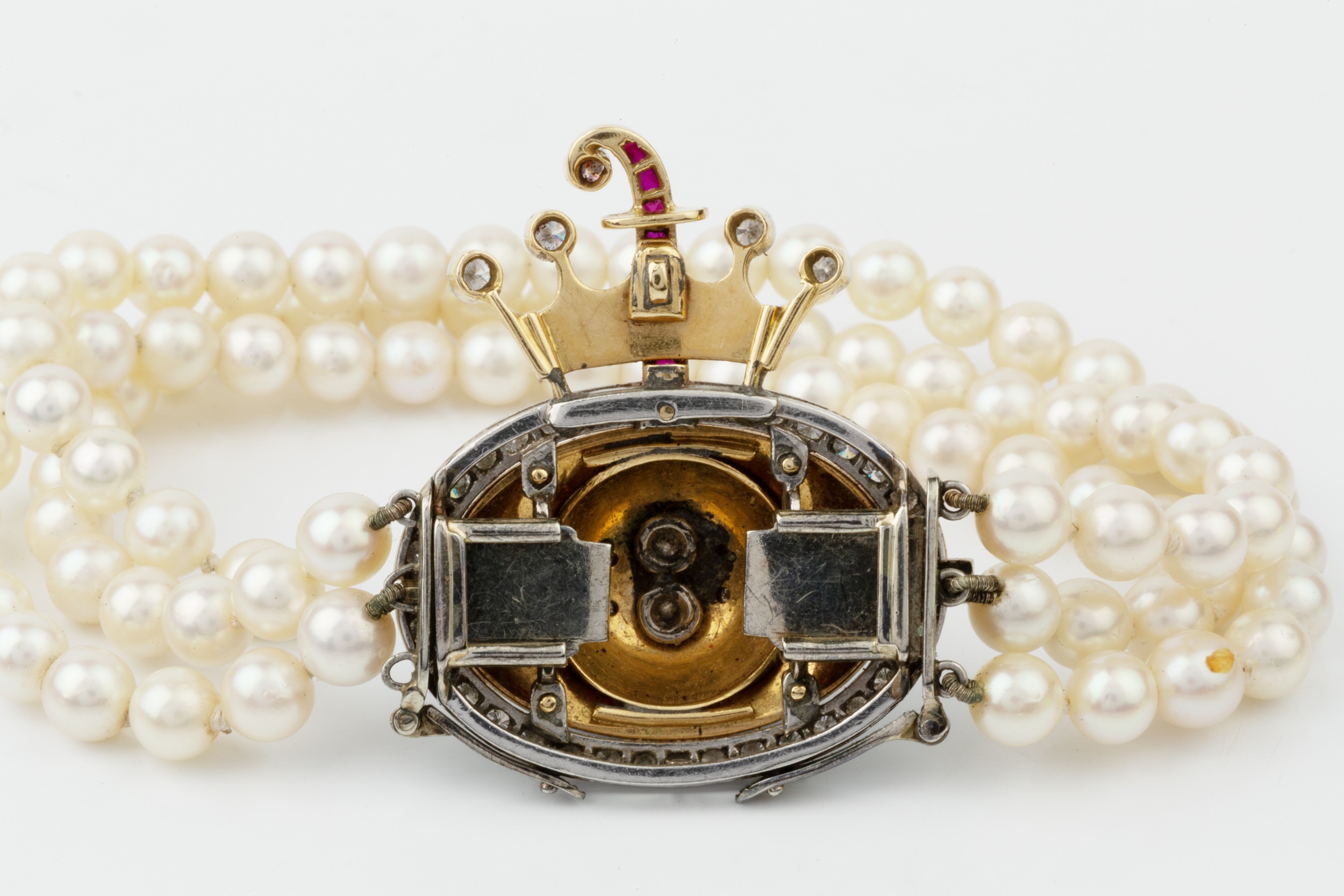 A three strand cultured pearl bracelet with diamond and enamel clasp, the detachable oval - Image 2 of 2