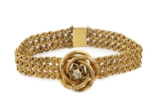 An Austro Hungarian gold bracelet, of flexible multi-link design, centred with a textured knot