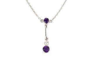 An 18ct white gold, amethyst and diamond necklace, the oval cut amethyst with a single collet set