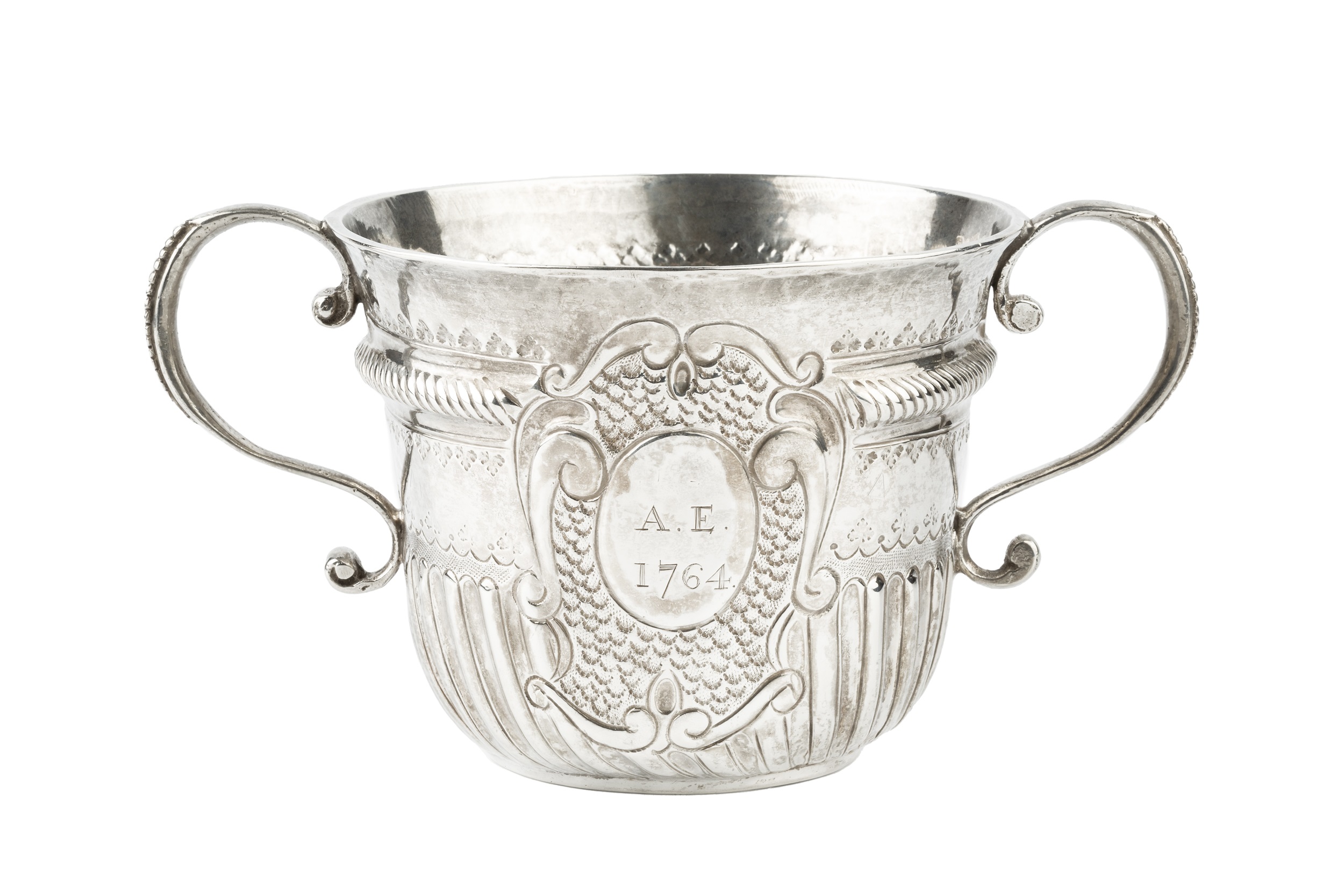 A Queen Anne Britannia standard silver porringer, with ropetwist girdled upper body and part lobed