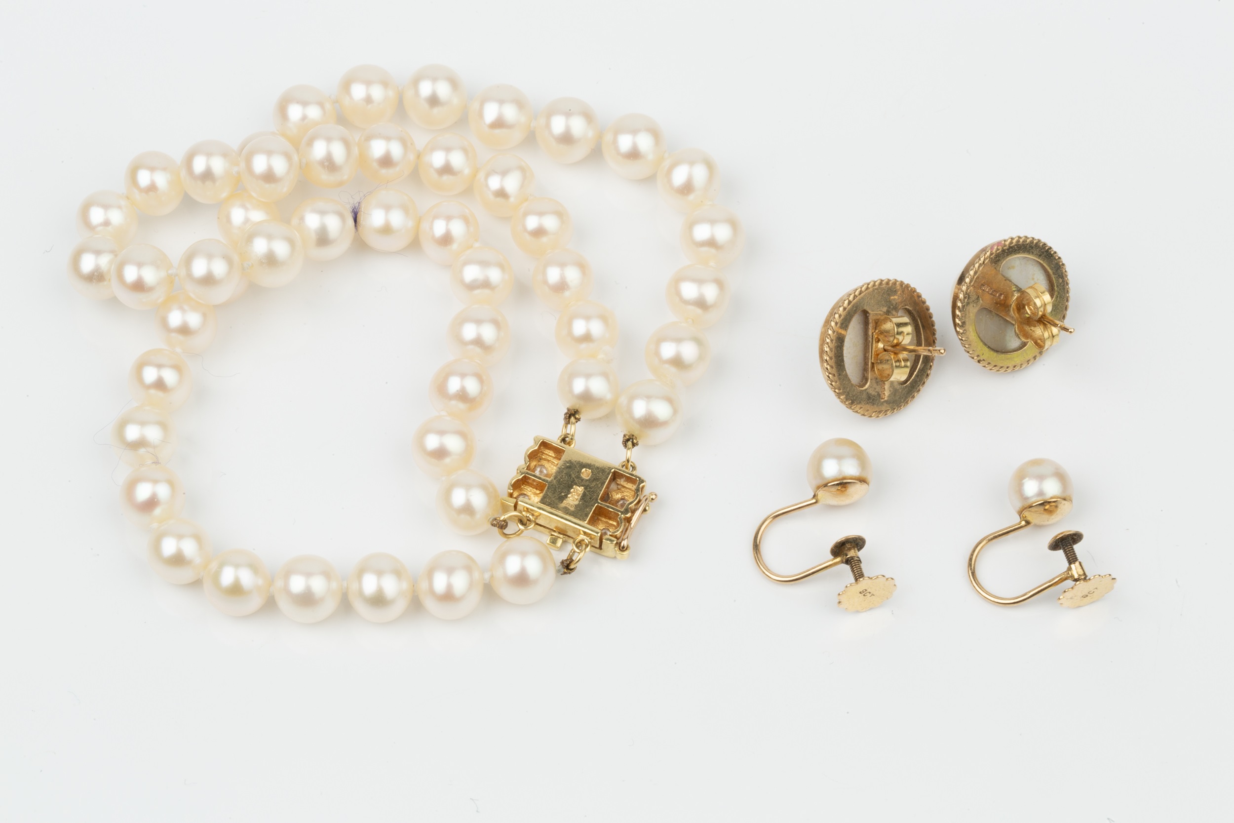 A twin strand uniform cultured pearl bracelet, the 18ct yellow gold clasp set with two lines of - Image 2 of 2