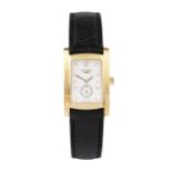 An 18ct gold lady's Dolcevita wristwatch by Longines, the rectangular white dial with seconds