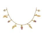 A small collection of jewellery, comprising a gem set flower brooch, a yellow metal necklace hung