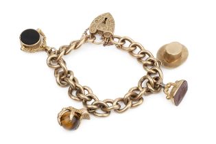 A 9ct gold curb link charm bracelet, with engraved padlock clasp, hung with various charms including