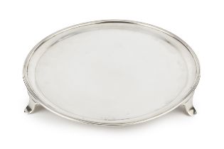 A George III Scottish silver circular small salver, with reeded border, on three plain feet, no